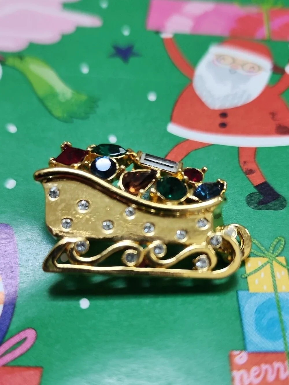 Monet Gold-tone Festive Sleigh Brooch with Multicolor Rhinestones